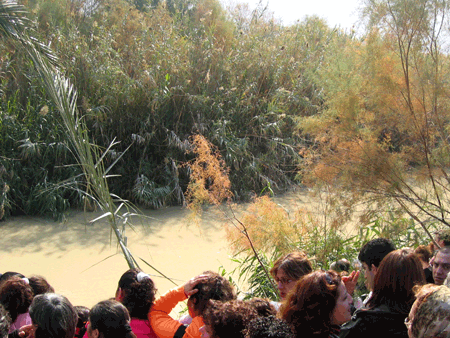 Pilgrims by the bank of the River Jordan in Judea