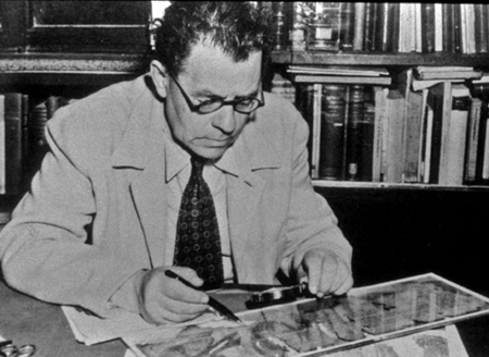 Professor Eleazar Sukenik examining one of the Dead Sea Scrolls