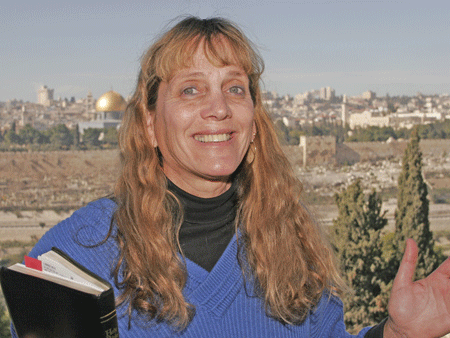 Gila guiding on the Mount of Olives with Jerusalem's Old City in the background Gila guiding on the Mount of Olives with Jerusalem's Old City in the background