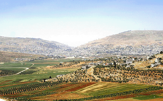 Mount Gerizim is on the left, Mount Ebal on the right with Shechem in the middle
