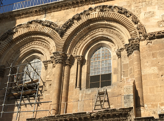 The ladder leans against the wall of the Armenian Chapel of St John