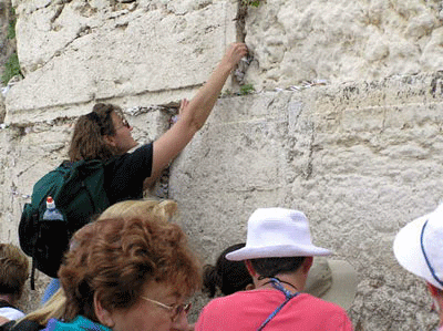 Putting a prayer request into the Western Wall